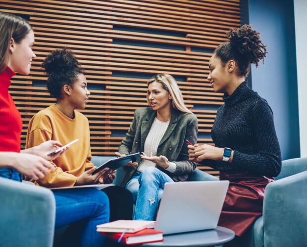 A group of clients giving feedback to a designer.