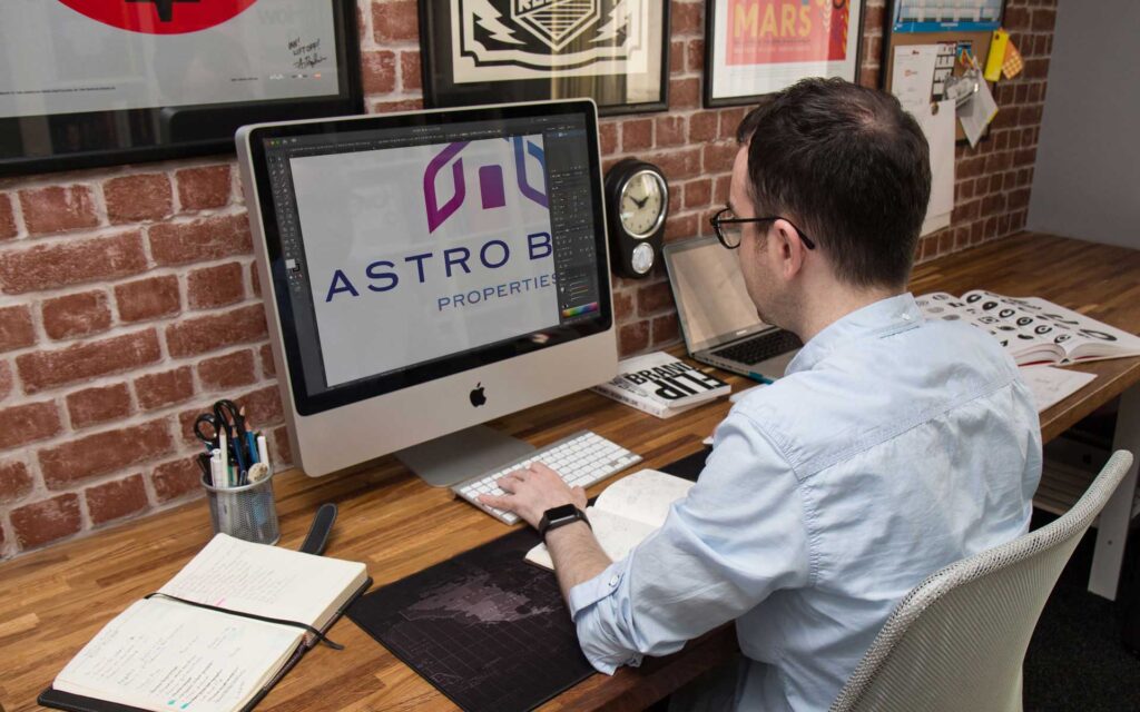 Ian Paget creating Vector logo artwork.