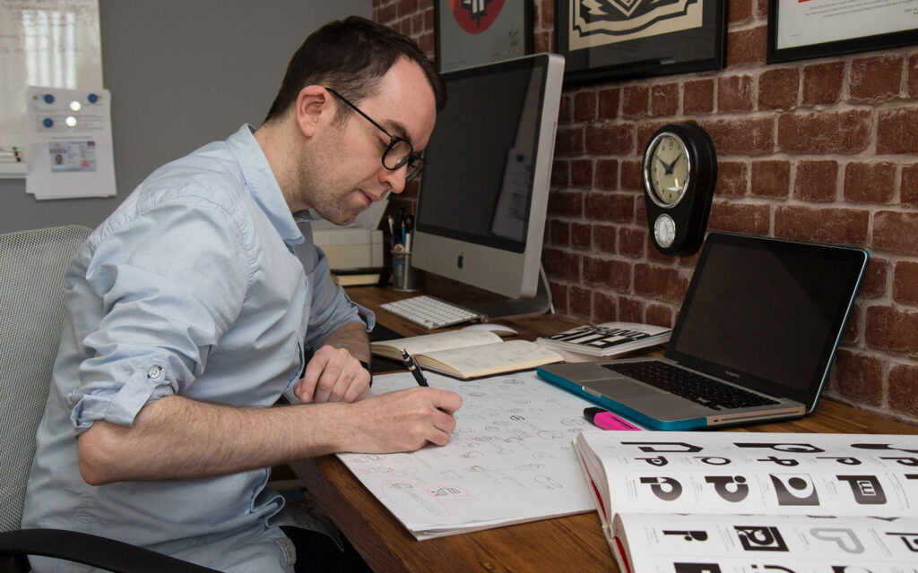 Ian Paget sketching logo ideas.